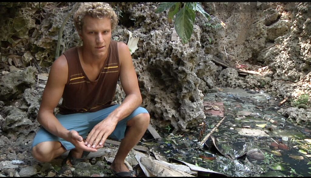 Kyle visiting a Septic Pit while on a Surf Trip